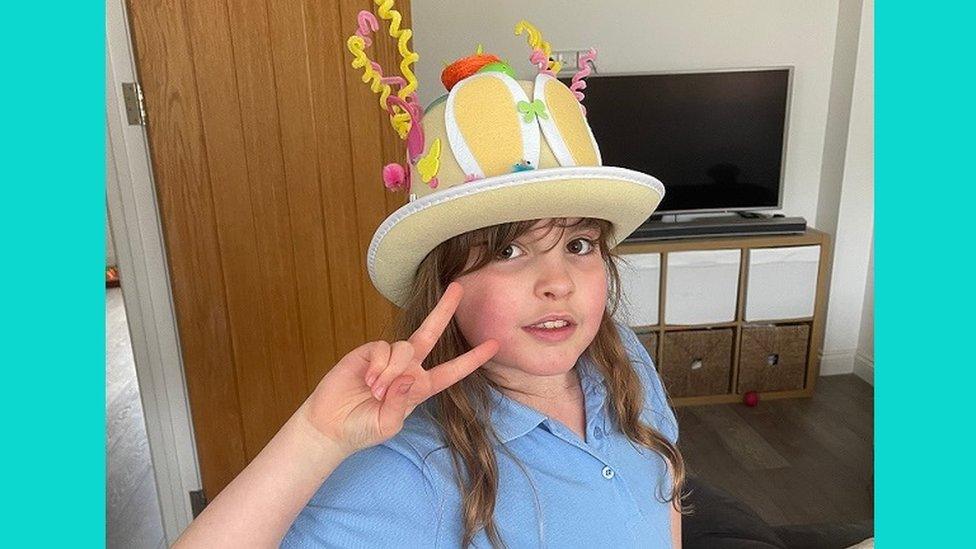 Girl in Easter bonnet.