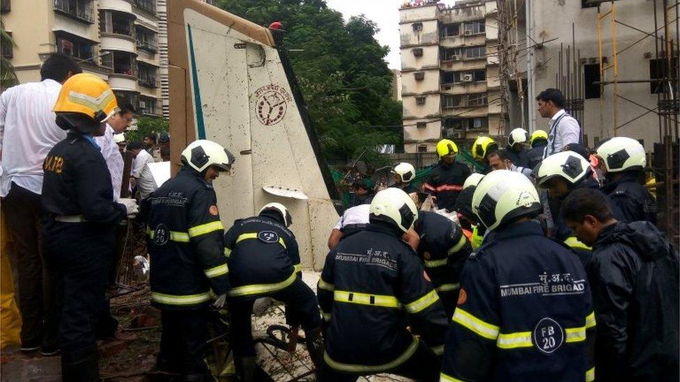 Firefighters inspect the sight of a plane crash in Mumbai, India June 28, 2018. REUTERS/Francis Mascarenhas