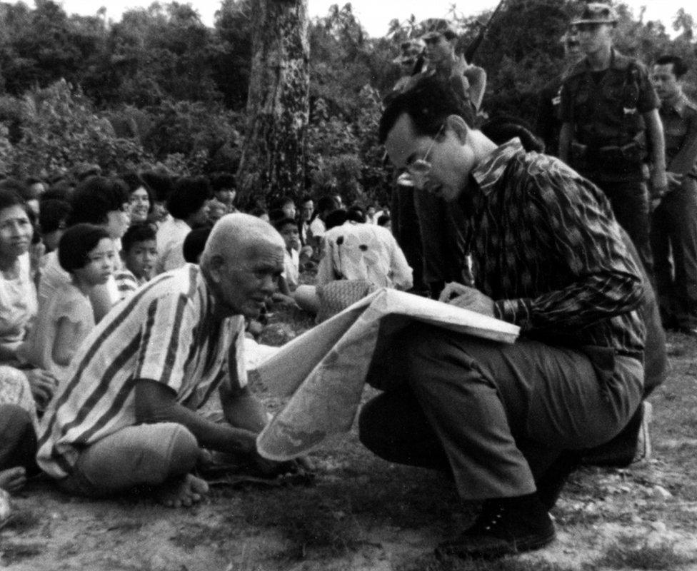 Picture shows King Bhumibol Adulyadej speaking to an old villager. Soul of A Nation - The Royal Family of Thailand is a unique film illustrating the life and problems of the present King and his family.