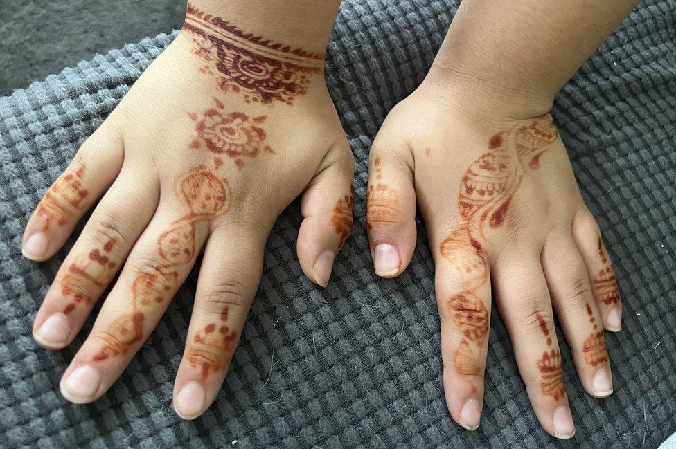 The henna designs on the hands of Ayah Lakehal, aged 12