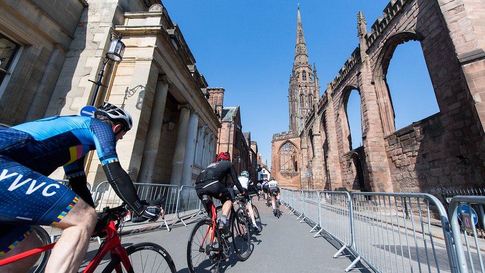 Cyclists passing through Coventry