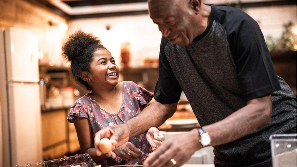 grandparent and child cooking