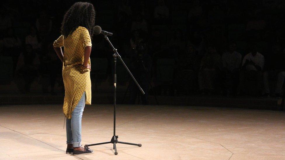 Woman reciting poetry