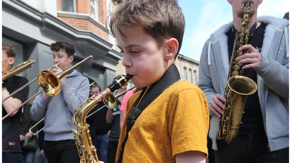 boy playing saxophone at Derry jazz festival