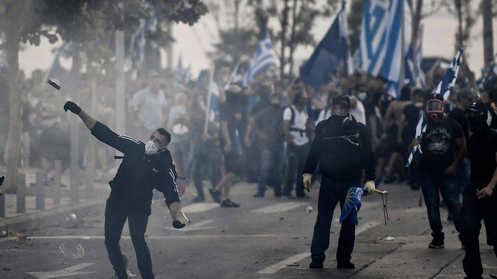 Protesters clash with police during a demonstration against the agreement reached by Greece and Macedonia