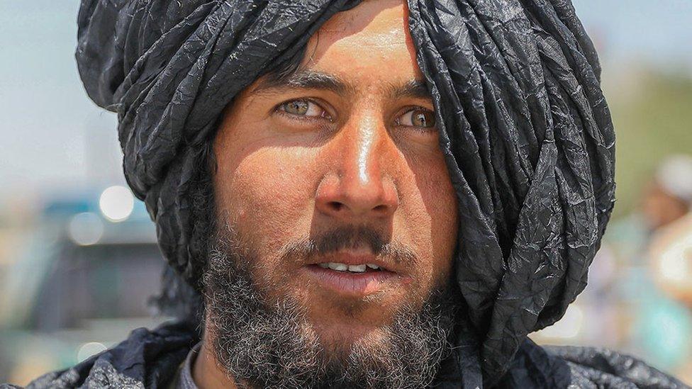 A Taliban fighter poses for a photograph in Kabul, Afghanistan, 16 August 2021