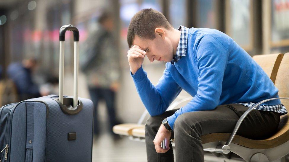 man waiting at airport