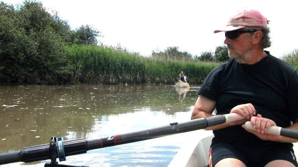 Terry Davey in his boat Big River