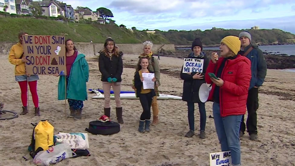 Protestors on Gyllyngvase Beach