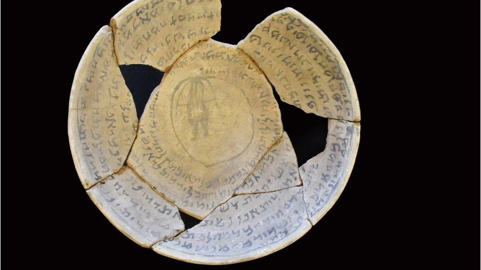 Fragments of a "swearing bowl" recovered in a raid in Jerusalem