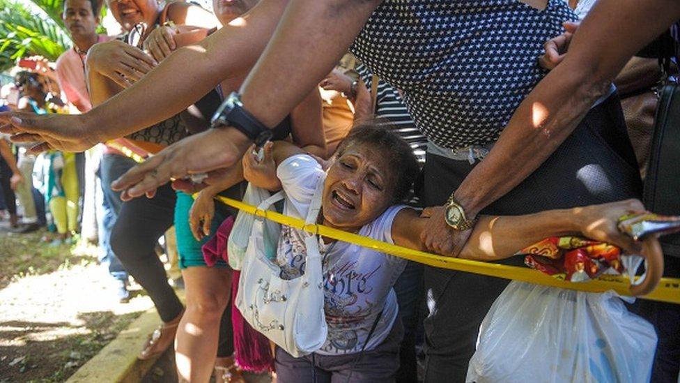 Cubans rally in front of the Ecuadorean embassy in Havana over new visa restrictions designed to stop Cuban migrants travelling through the region to the US