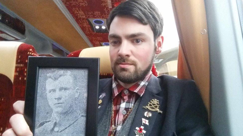 Callan Chevin on his way to the Somme with a photo of his great-great-grandfather's cousin Sergeant Alfred Sanders