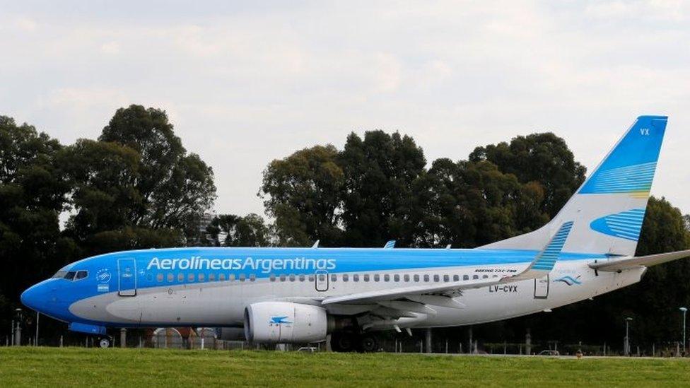 A Boeing 737-700 aircraft belonging to state-run Aerolineas Argentinas sits on the tarmac of the Buenos Aires" domestic airport