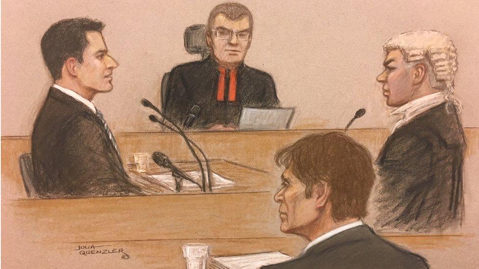 Cliff Richard looks on as Dan Johnson gives evidence