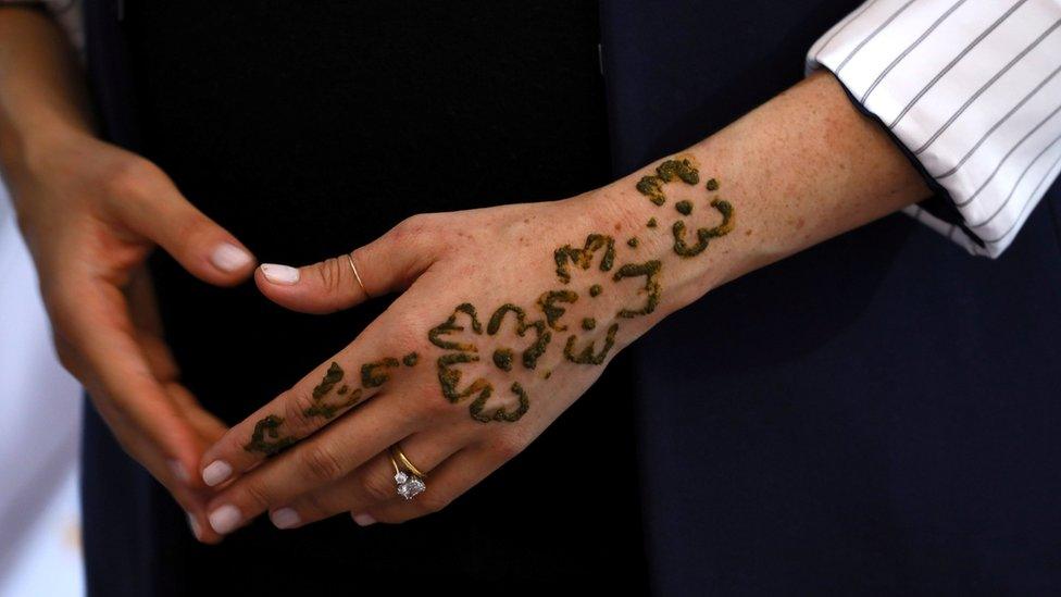 The Duchess of Sussex's hand with henna applied