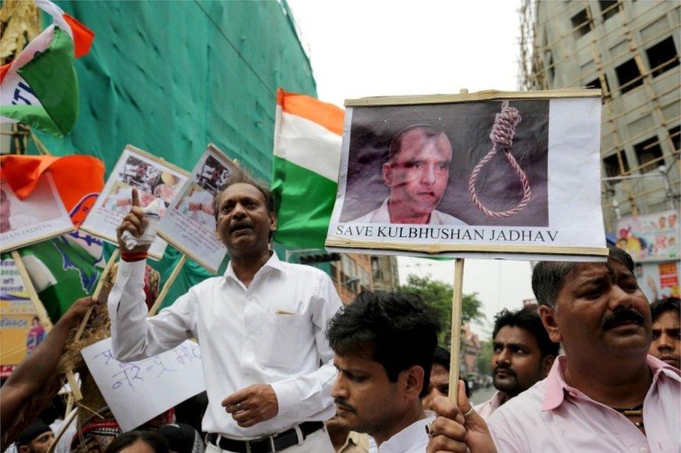 National Congress activists hold photographs of Indian national, Kulbhushan Jadhav, and placards against Prime Minister Narendra Modi in Calcutta, Eastern India 24 April 2017,