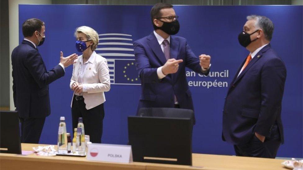 French President Emmanuel Macron (L) speaks with European Commission President Ursula von der Leyen as Hungary's Prime Minister Viktor Orban (R) speaks with Poland's Prime Minister Mateusz Morawiecki at the start of a two days face-to-face EU summit , in Brussels, Belgium, 10 December 2020.