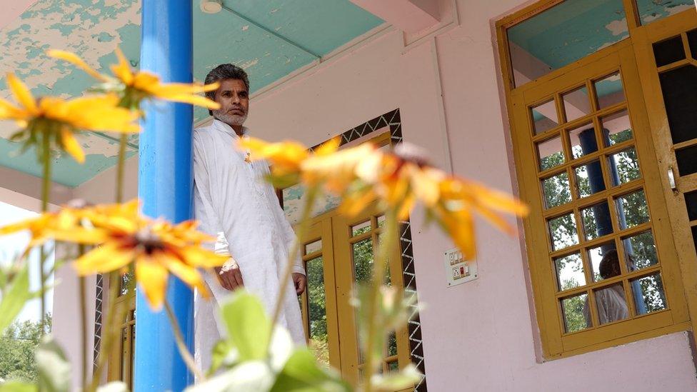 Bashir Ahmad Bhat at the entrance of his brother’s house.