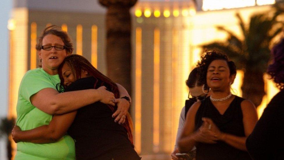 Women at a vigil outside the Mandalay bay hotel