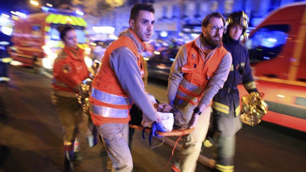 A woman being evacuated from the Bataclan concert hall on 13 November