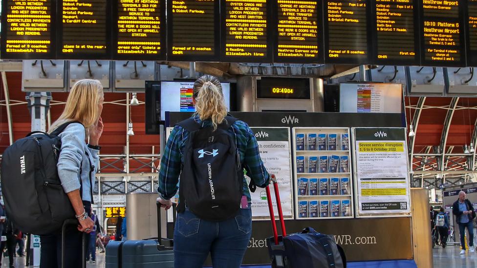 Train passengers at a station