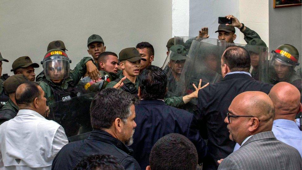 Scuffles outside the National Assembly in Caracas on 27 June