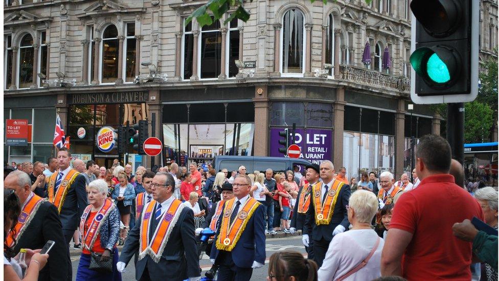 Orangemen and band members march in Belfast