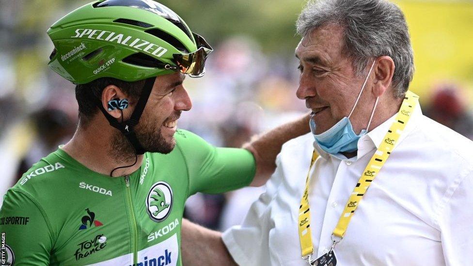 Mark Cavendish embraces Eddie Merckx at the 2021 Tour de France