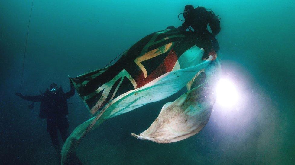 Divers with Royal Oak ensign