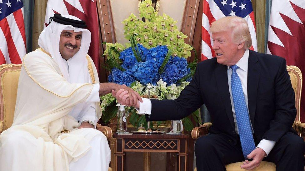 US President Donald Trump (R) and Qatar's Emir Sheikh Tamim Bin Hamad Al-Thani take part in a bilateral meeting at a hotel in Riyadh in May 2017