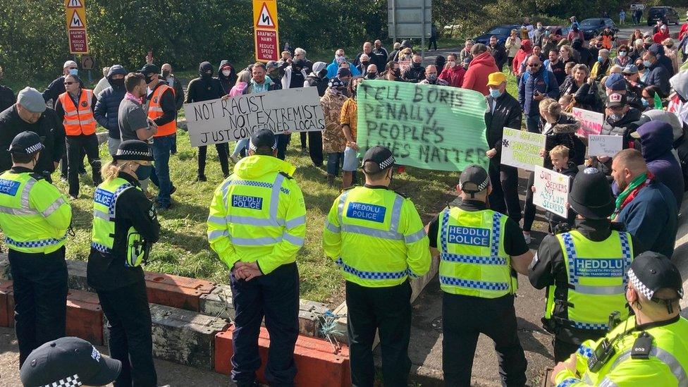 Police flank protesters