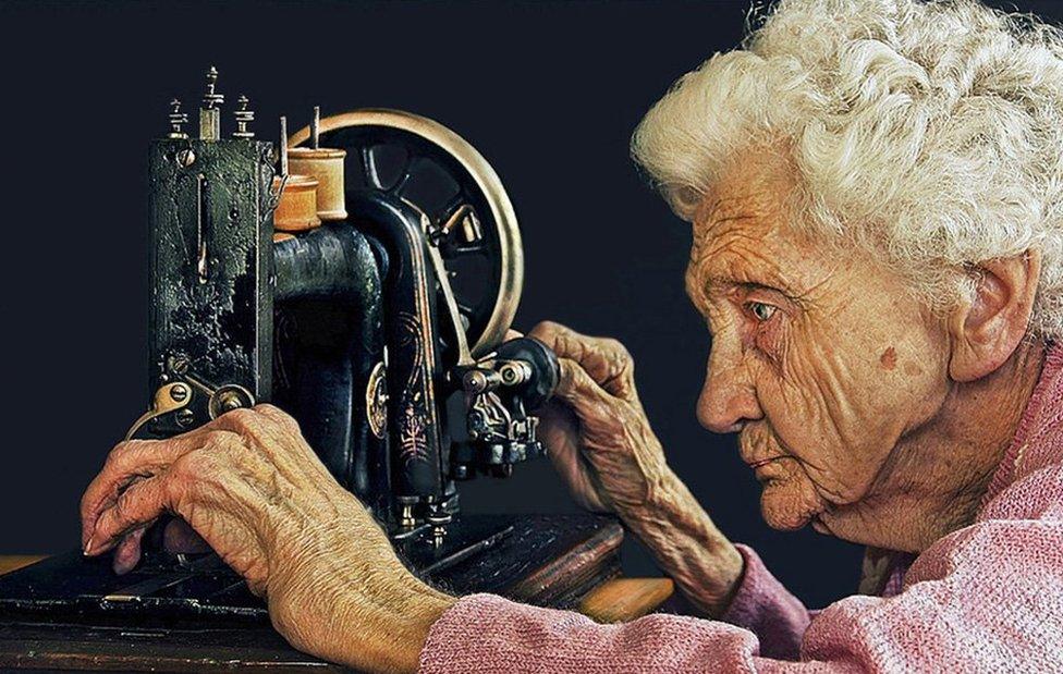 91 year old woman adjusting her sewing machine