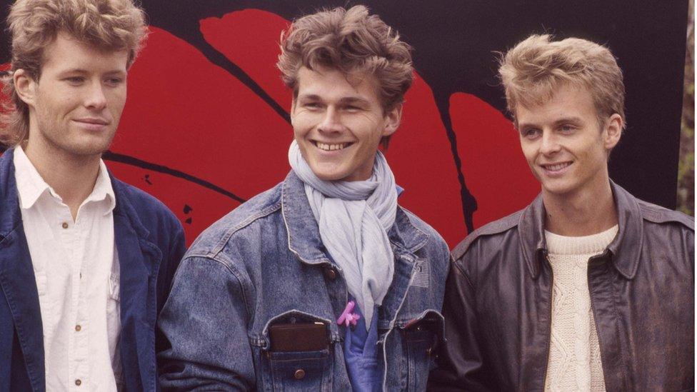 Norwegian pop group A-ha at a shoot to promote the James Bond film 'The Living Daylights', for which the group performed the theme song, UK, 30th March 1987. (Photo by Michael Putland/Getty Images) Left to right: Mags Furuholmen, Morten Harket, Pal Waaktaar. (Photo by Michael Putland/Getty Images)