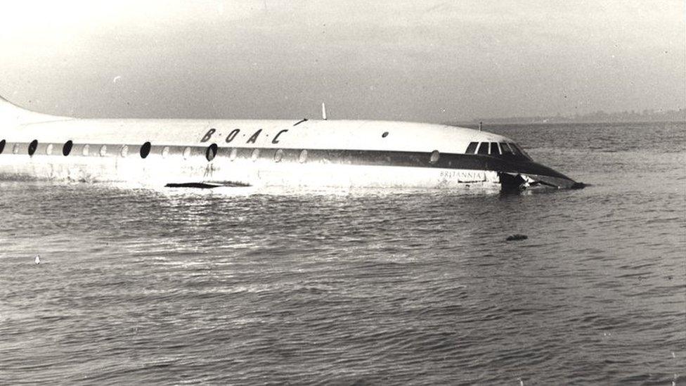 A photo of a plane being submerged by water in the River Severn