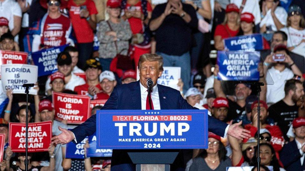 trump speaking to supporters in a rally in florida