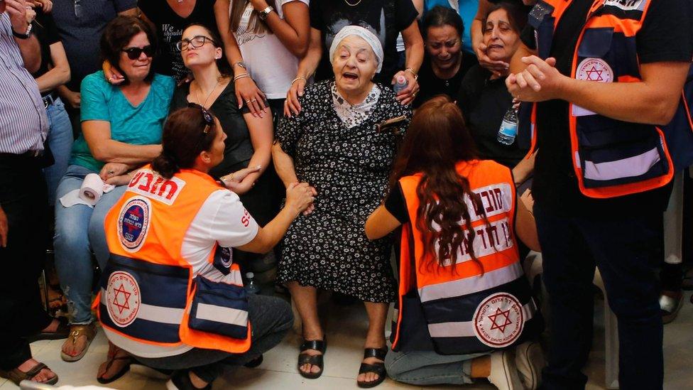 Relatives and friends mourn during the funeral of Yotam Ovadia in Jerusalem cemetery, on July 27, 2018.