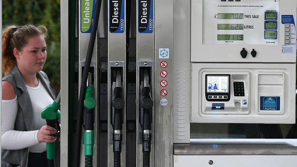 Woman at petrol station