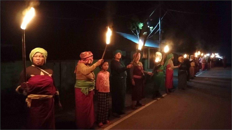 Women form human chain protest demanding peace n India's north-eastern Manipur state on June 17, 2023