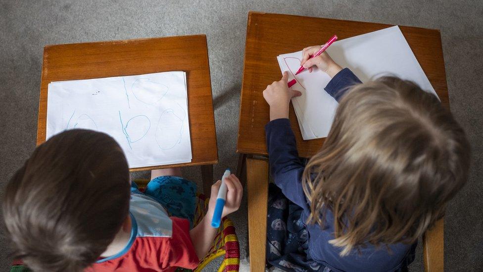 Children practising their schoolwork