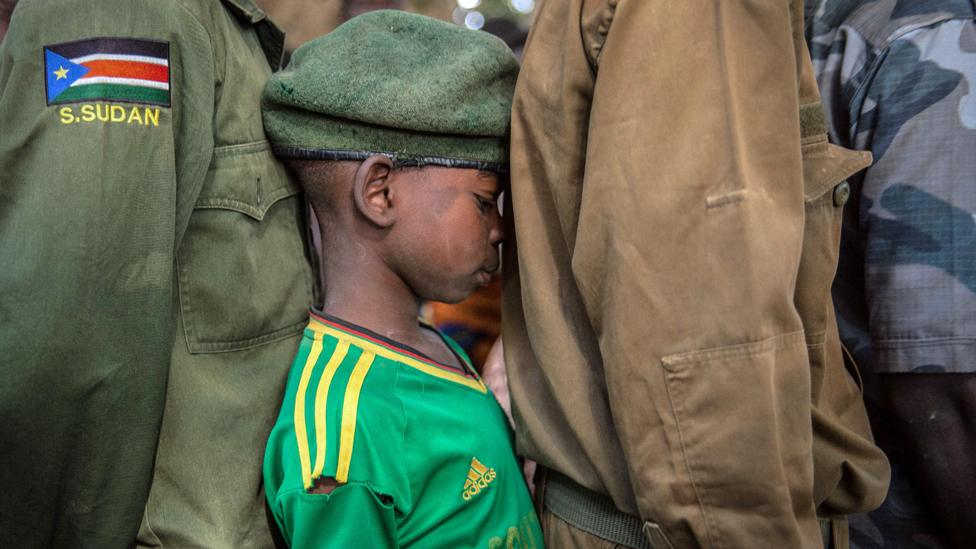 Newly released child soldiers wait in a line for their registration during the release ceremony in Yambio, South Sudan - 7 February 2018