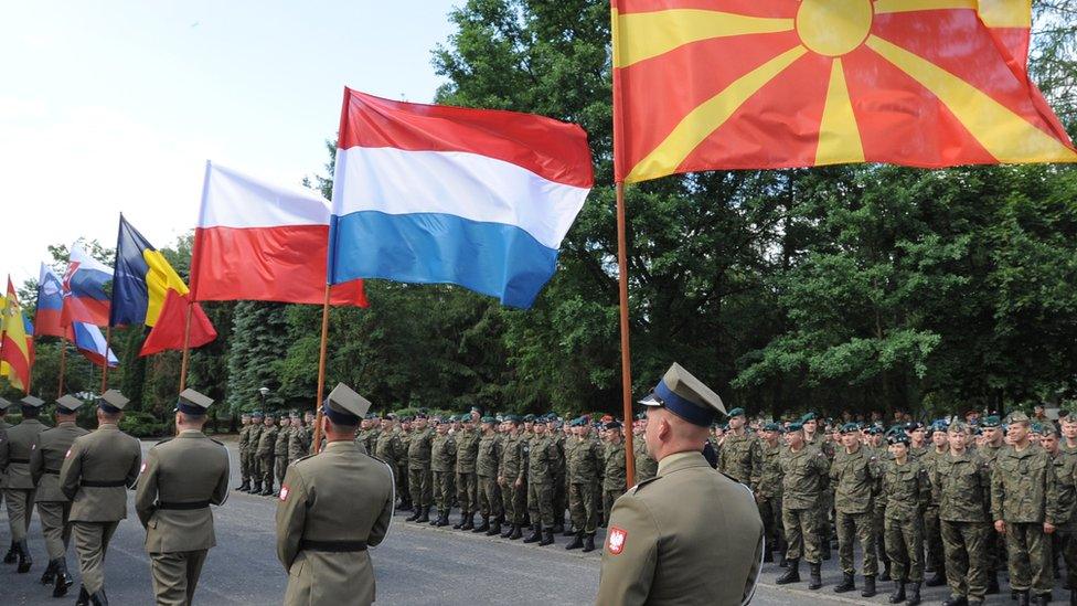 Flags held up by soldiers during opening ceremony ,6 June 2016