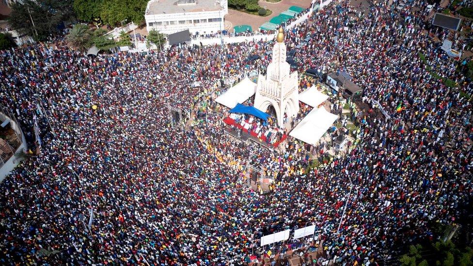 An aerial view shows protesters gathering for a demonstration in the Independence square in Bamako on June 19, 2020.