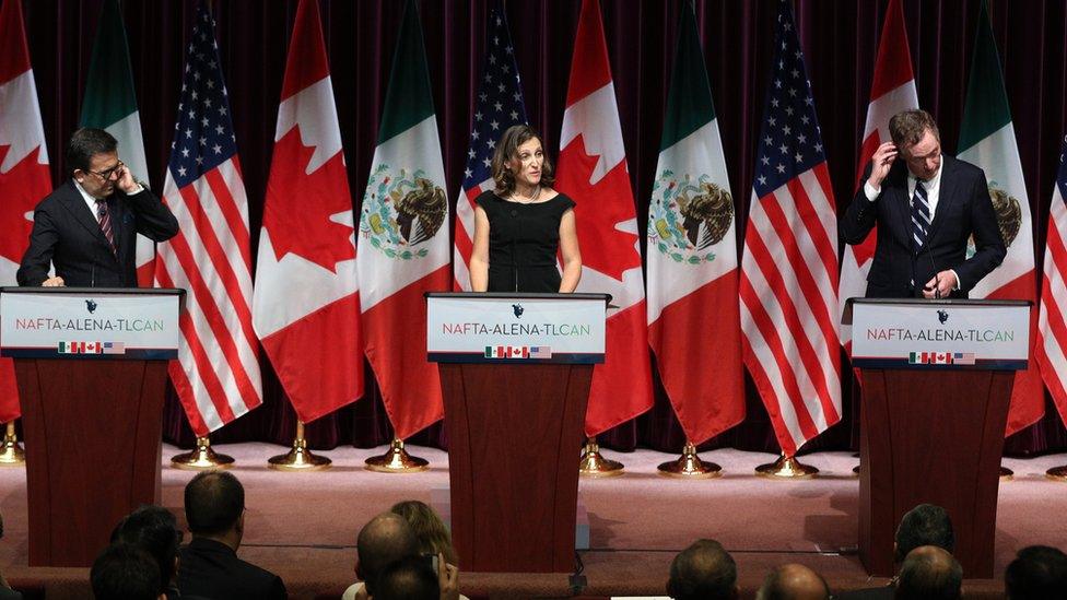 Canadas Minister of Foreign Affairs Chrystia Freeland(C), Mexicos Secretary of Economy Ildefonso Guajardo Villarreal(L) and United States Trade Representative Robert E. Lighthizer make statements during Global Affairs on the final day of the third round of the NAFTA renegotiations in Ottawa, Ontario, September 27, 2017.