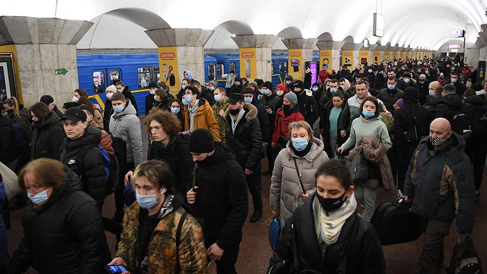 People taking shelter in metro station