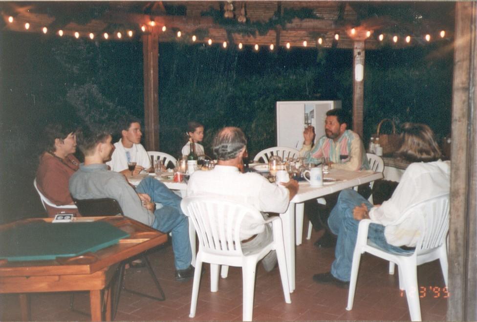 The Hargroves eating dinner with their neighbours and friends