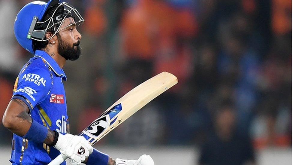 Mumbai Indians' captain Hardik Pandya walks back to the pavilion after his dismissal during the Indian Premier League (IPL) Twenty20 cricket match between Sunrisers Hyderabad and Mumbai Indians at the Rajiv Gandhi International Stadium in Hyderabad on March 27, 2024. (