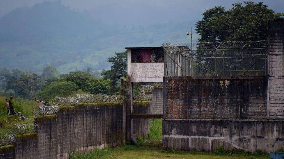 Security forces stand guard outside the premises of the Bellavista prison, in Santo Domingo de los Colorados, some 80 km (50 miles) from Quito, on May 10, 2022