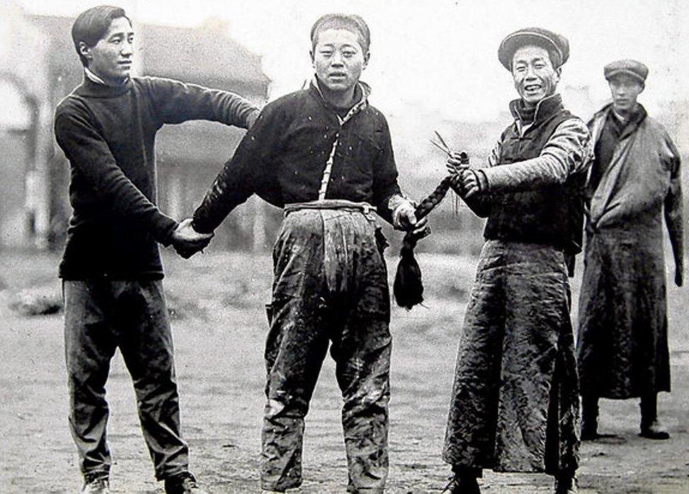 Cutting off a man's plait in China in 1912