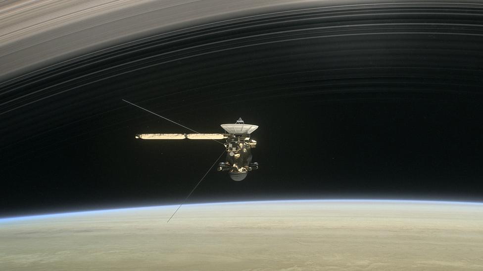 Artwork: Cassini is running the narrow gap between the top of the planet's atmosphere and the rings