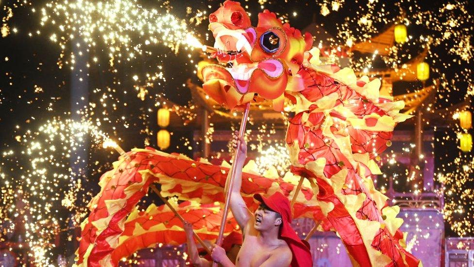 Dragon dancers perform at a park on the first day of the Lunar New Year of the Dragon in Beijing on February 10, 2024.